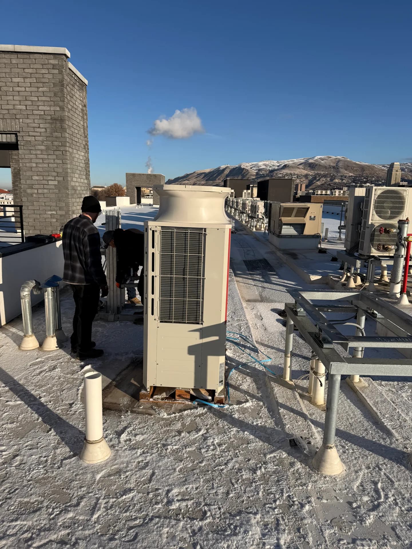 A rooftop heat pump system installed by the All Around crew